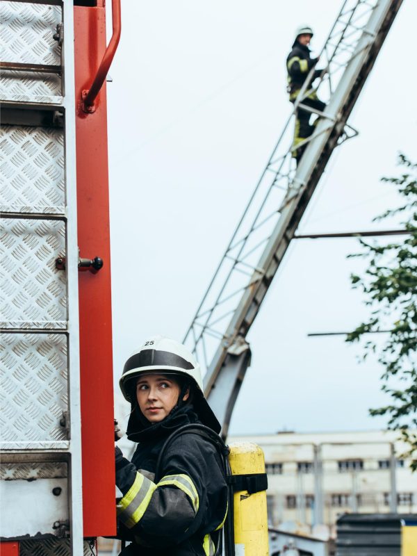 female-firefighter-in-uniform-and-helmet-looking-a-2023-11-27-05-36-40-utc