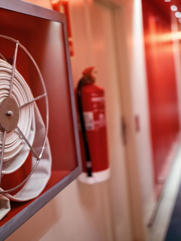 fire-extinguisher-and-hose-reel-in-hotel-corridor-2023-11-27-05-09-36-utc