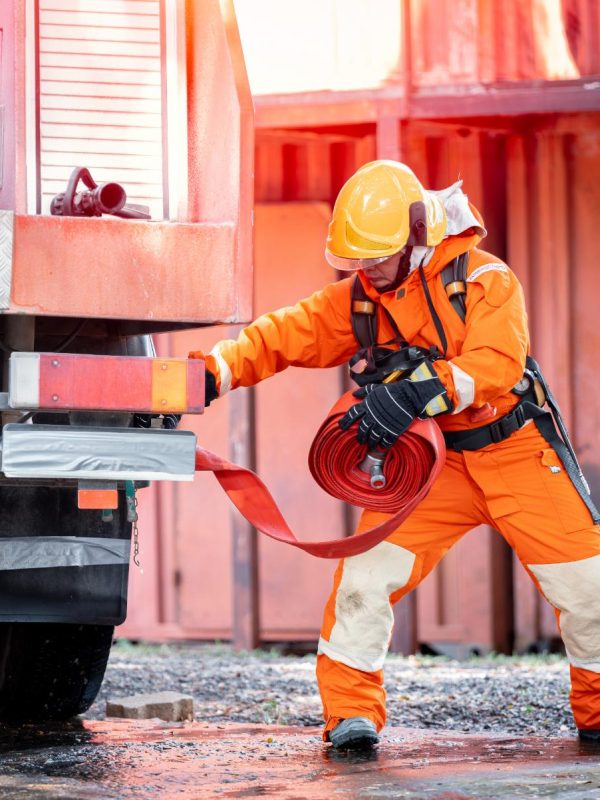 firefighter-man-wearing-protective-fire-suite-and-2023-11-27-05-20-25-utc