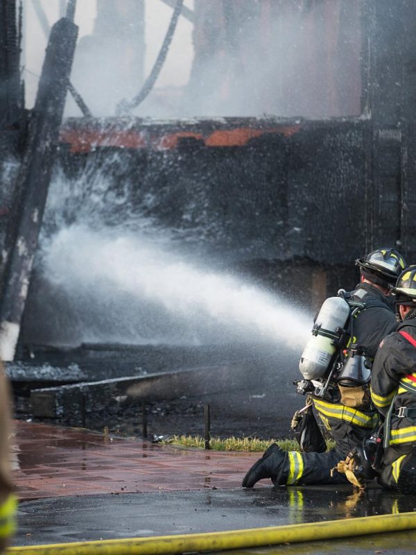 firefighter-sprays-water-on-burning-house-fire-2023-11-27-05-25-41-utc